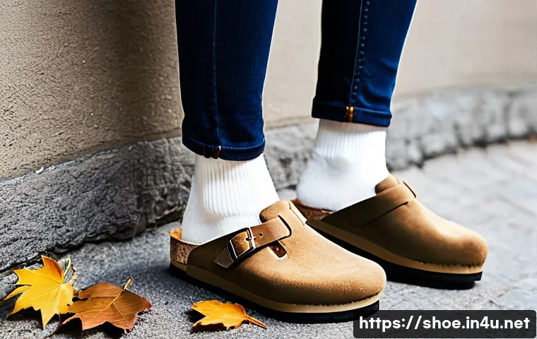 버켄스탁 보스턴과 취리히 샌들 비교 - **Birkenstock Boston: Effortless Autumnal Comfort**
A young adult, gender-neutral, stands comfor...